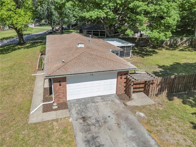 view of front of home with brick siding, roof with shingles, driveway, and a garage