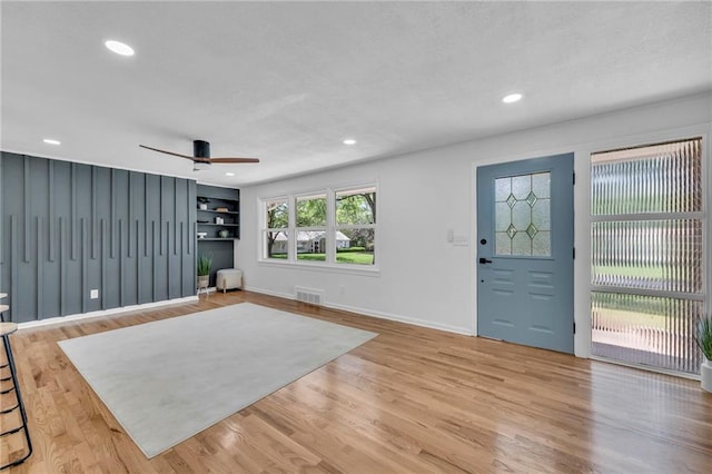 foyer with a ceiling fan, light wood-style floors, baseboards, recessed lighting, and a textured ceiling