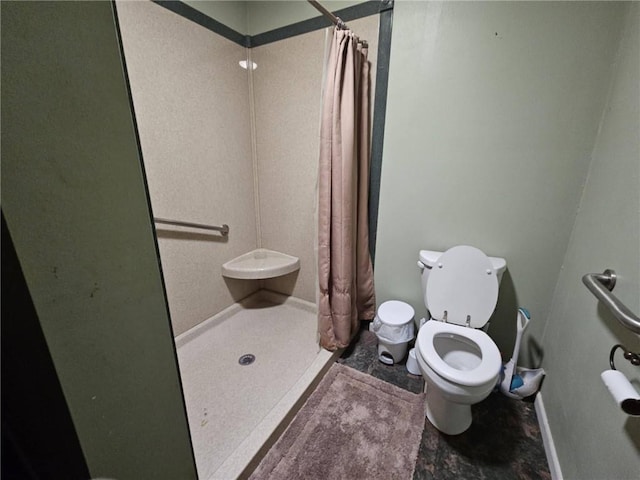 201 2nd St, Uniontown, KS 66779 - bathroom featuring a shower stall and toilet