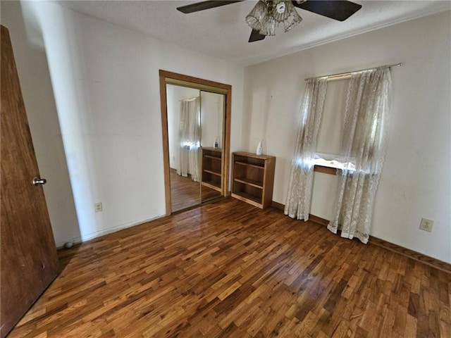 201 2nd St, Uniontown, KS 66779 - unfurnished room with a ceiling fan and wood finished floors