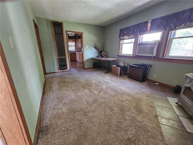 201 2nd St, Uniontown, KS 66779 - spare room with a textured ceiling and cooling unit
