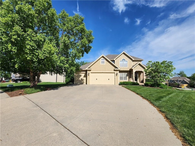 14650 NW 66th Ter, Parkville, MO 64152 - view of front of property featuring stucco siding, driveway, a front lawn, and a garage
