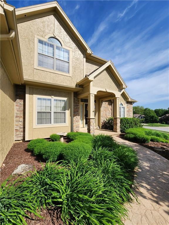 14650 NW 66th Ter, Parkville, MO 64152 - view of front of house with stucco siding and stone siding