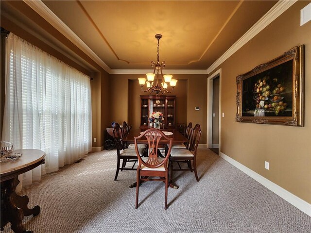 14650 NW 66th Ter, Parkville, MO 64152 - dining area featuring a chandelier, light colored carpet, a raised ceiling, baseboards, and ornamental molding