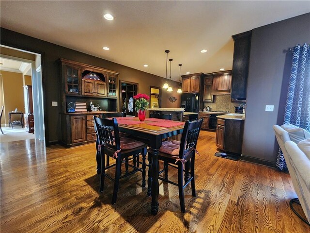 14650 NW 66th Ter, Parkville, MO 64152 - dining area with wood finished floors and recessed lighting
