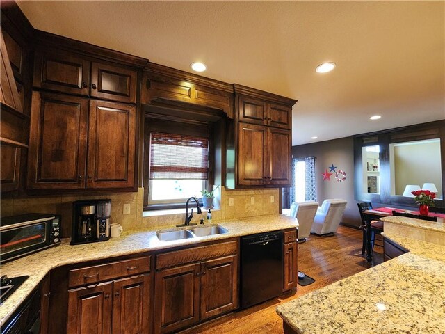 14650 NW 66th Ter, Parkville, MO 64152 - kitchen with black appliances, a sink, light wood finished floors, recessed lighting, and decorative backsplash