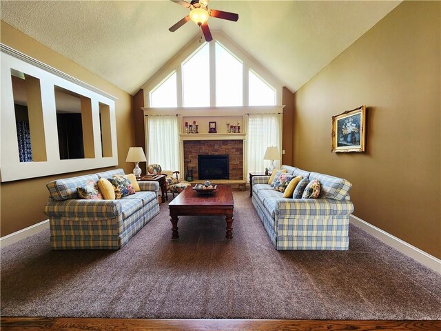 14650 NW 66th Ter, Parkville, MO 64152 - living room with carpet floors, baseboards, ceiling fan, vaulted ceiling, and a stone fireplace
