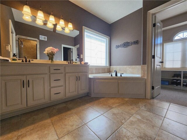 14650 NW 66th Ter, Parkville, MO 64152 - full bathroom with double vanity, a bath, a shower with shower door, and tile patterned flooring