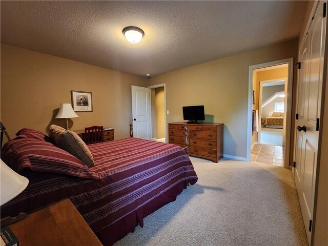 14650 NW 66th Ter, Parkville, MO 64152 - carpeted bedroom with a textured ceiling and baseboards
