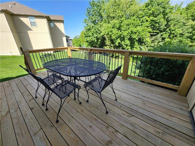 14650 NW 66th Ter, Parkville, MO 64152 - deck featuring outdoor dining space and a lawn