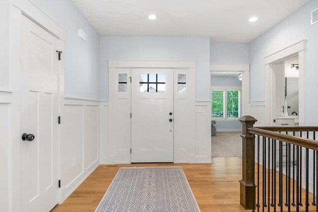 4403 Goldfield St, Lawrence, KS 66049 - entrance foyer with a wainscoted wall, light wood-style floors, a decorative wall, and recessed lighting
