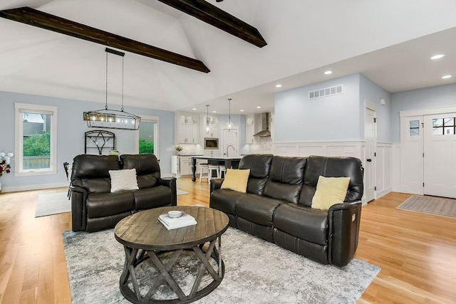 4403 Goldfield St, Lawrence, KS 66049 - living area with light wood-style floors, beamed ceiling, plenty of natural light, high vaulted ceiling, and recessed lighting