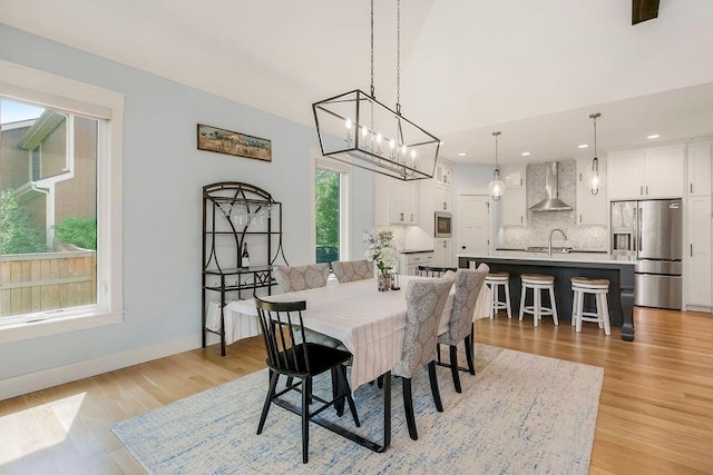 4403 Goldfield St, Lawrence, KS 66049 - dining room featuring light wood-style flooring, baseboards, a chandelier, and recessed lighting