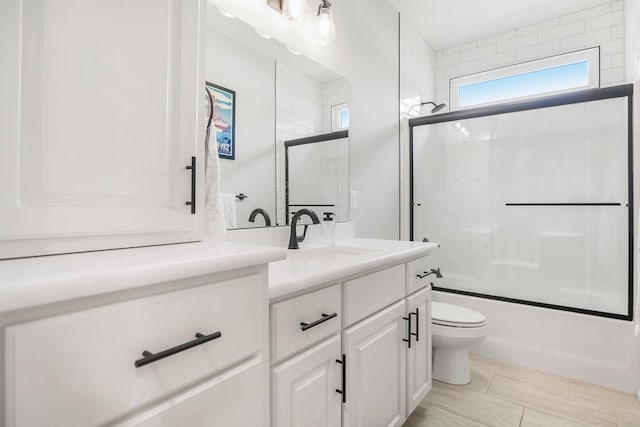4403 Goldfield St, Lawrence, KS 66049 - full bath with vanity, toilet, and combined bath / shower with glass door