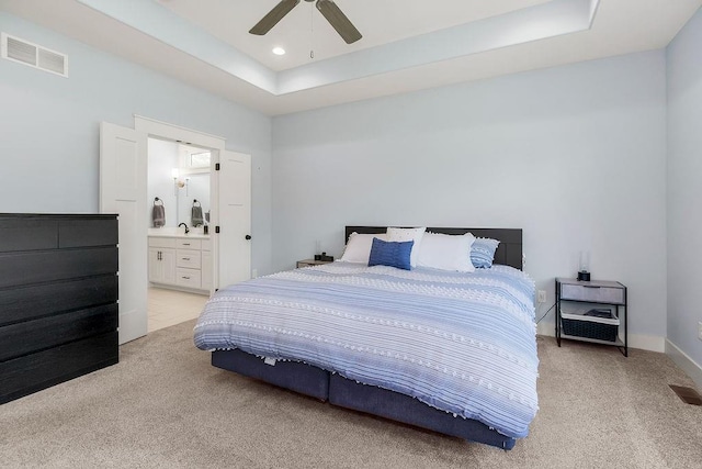 4403 Goldfield St, Lawrence, KS 66049 - bedroom with light colored carpet, a tray ceiling, recessed lighting, and ensuite bathroom