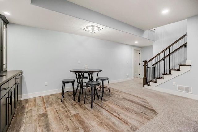 4403 Goldfield St, Lawrence, KS 66049 - dining area with recessed lighting, light wood finished floors, baseboards, and stairs