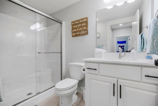 4403 Goldfield St, Lawrence, KS 66049 - full bath with vanity, toilet, a shower stall, and baseboards