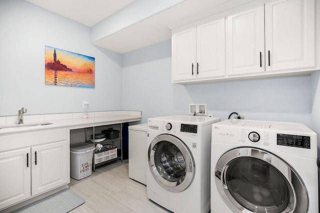 4403 Goldfield St, Lawrence, KS 66049 - laundry area featuring washing machine and dryer and cabinet space