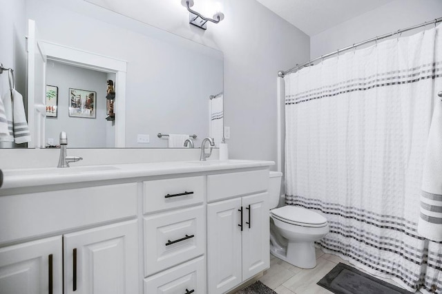 4403 Goldfield St, Lawrence, KS 66049 - bathroom with double vanity, toilet, tile patterned floors, and a shower with curtain