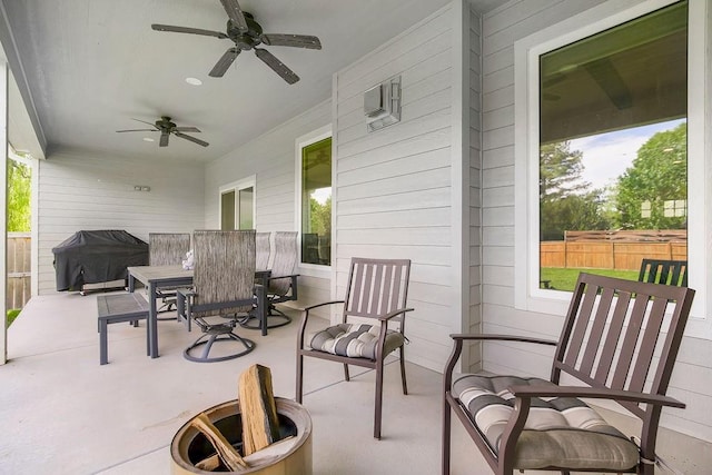 4403 Goldfield St, Lawrence, KS 66049 - view of patio featuring grilling area, a ceiling fan, outdoor dining space, and a fire pit