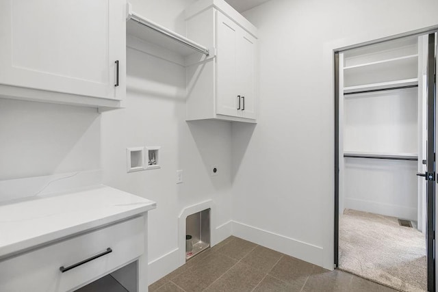 laundry area featuring cabinet space, washer hookup, baseboards, and electric dryer hookup