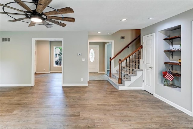 16253 W Briarwood Ct, Olathe, KS 66062 - entrance foyer with ceiling fan, wood finished floors, recessed lighting, stairway, and baseboards