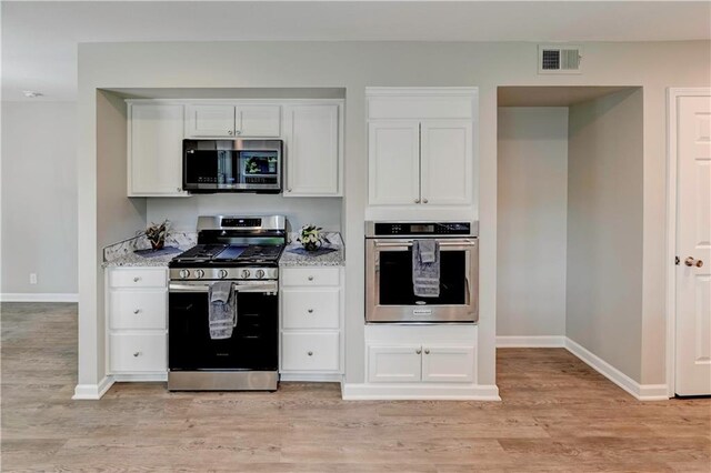 16253 W Briarwood Ct, Olathe, KS 66062 - kitchen featuring stainless steel appliances, baseboards, light wood finished floors, and white cabinetry