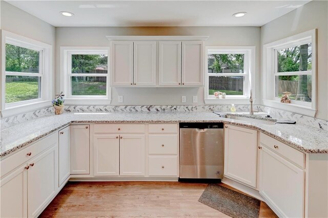 16253 W Briarwood Ct, Olathe, KS 66062 - kitchen featuring dishwasher, healthy amount of natural light, white cabinets, and a sink