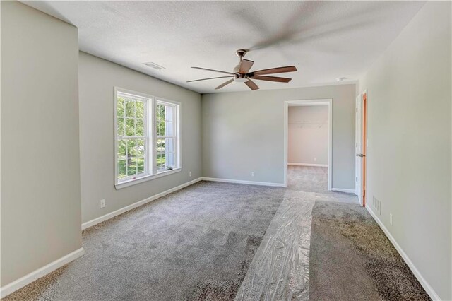 16253 W Briarwood Ct, Olathe, KS 66062 - empty room featuring carpet floors, a ceiling fan, baseboards, and a textured ceiling