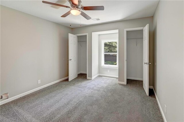 16253 W Briarwood Ct, Olathe, KS 66062 - unfurnished bedroom featuring two closets, carpet floors, baseboards, and a ceiling fan