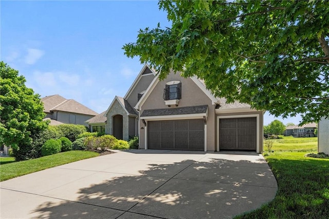 10233 N Prospect Ave, Kansas City, MO 64155 - view of front of property with concrete driveway, stucco siding, an attached garage, and a front lawn