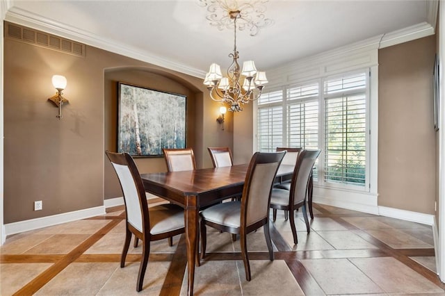 10233 N Prospect Ave, Kansas City, MO 64155 - dining area featuring inlaid floor details, baseboards, a chandelier, and ornamental molding