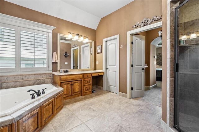 10233 N Prospect Ave, Kansas City, MO 64155 - full bath featuring a jetted tub, vanity, lofted ceiling, a shower stall, and baseboards