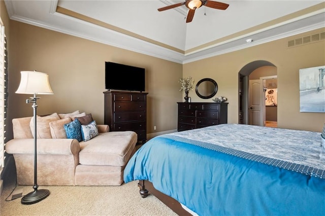 10233 N Prospect Ave, Kansas City, MO 64155 - carpeted bedroom featuring a raised ceiling, ornamental molding, arched walkways, and ceiling fan