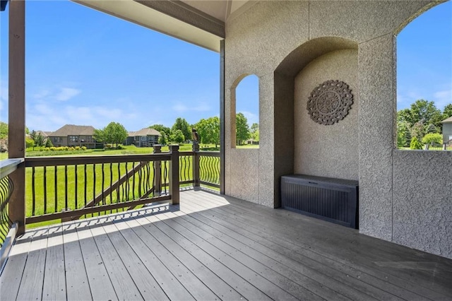 10233 N Prospect Ave, Kansas City, MO 64155 - wooden deck featuring a residential view, radiator, and a yard