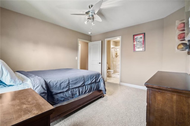10233 N Prospect Ave, Kansas City, MO 64155 - bedroom with light carpet, baseboards, ensuite bathroom, and ceiling fan