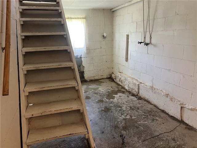 5720 NW 51st St, Kansas City, MO 64151 - stairway with concrete block wall and unfinished concrete flooring