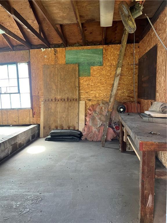 5720 NW 51st St, Kansas City, MO 64151 - miscellaneous room with unfinished concrete floors and vaulted ceiling