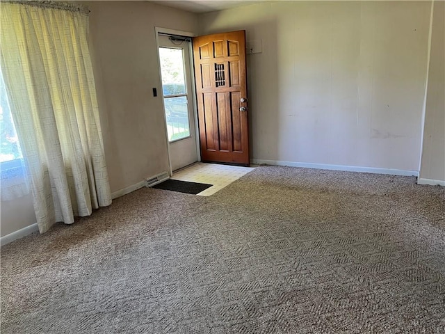5720 NW 51st St, Kansas City, MO 64151 - entryway featuring baseboards and light colored carpet