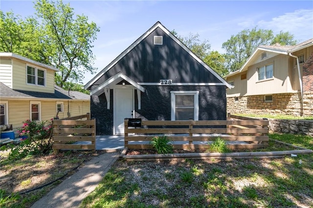 228 N 26th St, Kansas City, KS 66102 - bungalow-style home featuring fence