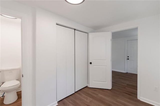 228 N 26th St, Kansas City, KS 66102 - unfurnished bedroom featuring wood finished floors and a closet