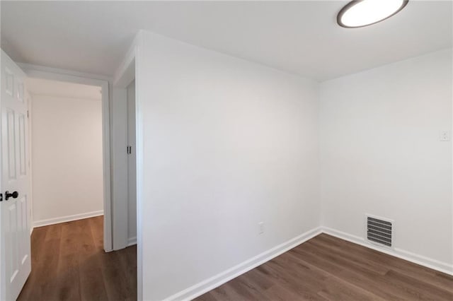 228 N 26th St, Kansas City, KS 66102 - unfurnished room featuring dark wood-style floors and baseboards