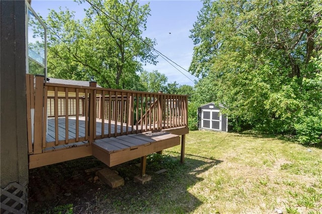 228 N 26th St, Kansas City, KS 66102 - view of grassy yard with a storage shed, a wooden deck, and an outbuilding