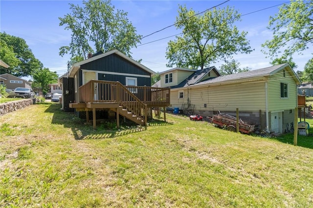 228 N 26th St, Kansas City, KS 66102 - back of house featuring a wooden deck, stairs, and a yard