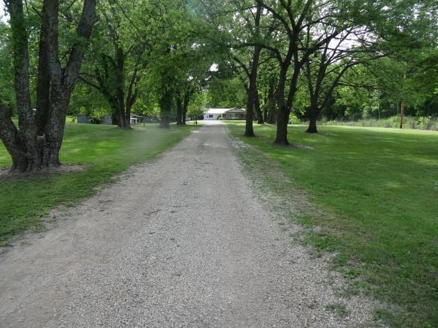 6780 SW County Road 2007th Rd, Rich Hill, MO 64779 - view of dirt / gravel driveway