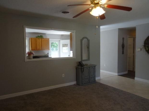 6780 SW County Road 2007th Rd, Rich Hill, MO 64779 - unfurnished living room with a ceiling fan