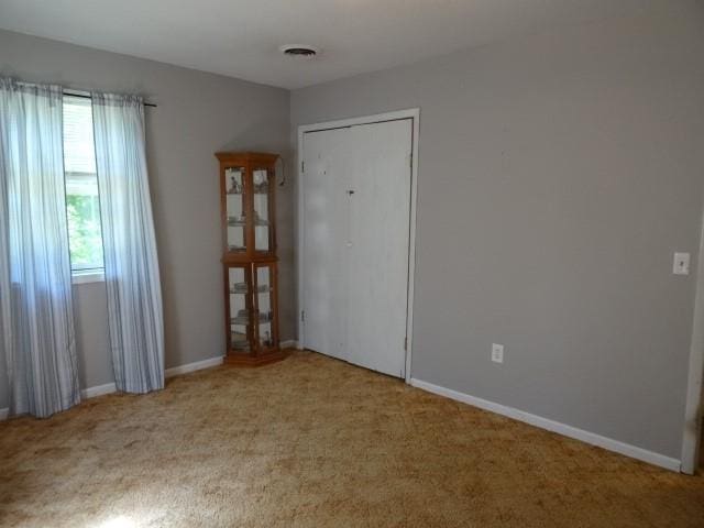 6780 SW County Road 2007th Rd, Rich Hill, MO 64779 - unfurnished room with carpet floors and baseboards