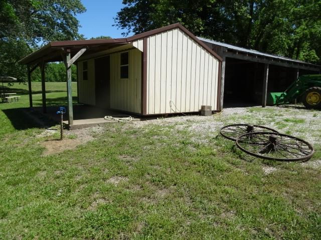 6780 SW County Road 2007th Rd, Rich Hill, MO 64779 - view of outdoor structure featuring an outbuilding and a carport