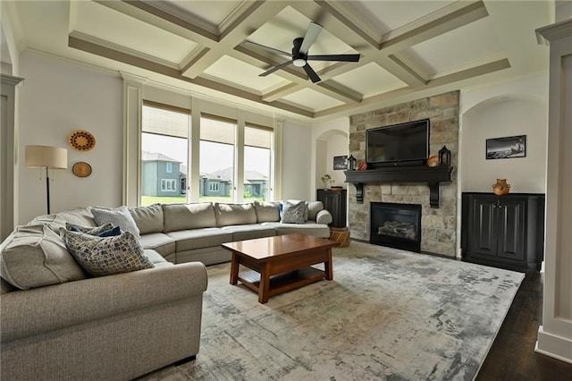 15601 Windsor St, Overland Park, KS 66224 - living room with a stone fireplace, ceiling fan, coffered ceiling, beam ceiling, and wood finished floors