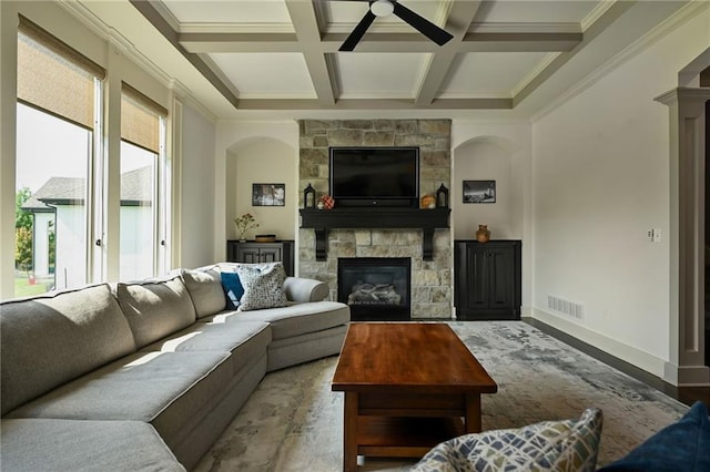 15601 Windsor St, Overland Park, KS 66224 - living area with ceiling fan, a fireplace, coffered ceiling, beamed ceiling, and arched walkways